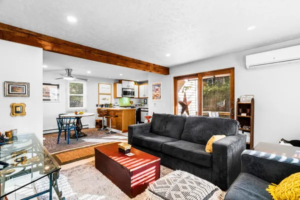 a view of a a dining room with furniture window and outside view