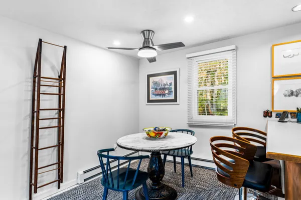 a kitchen with a stove a sink and a window