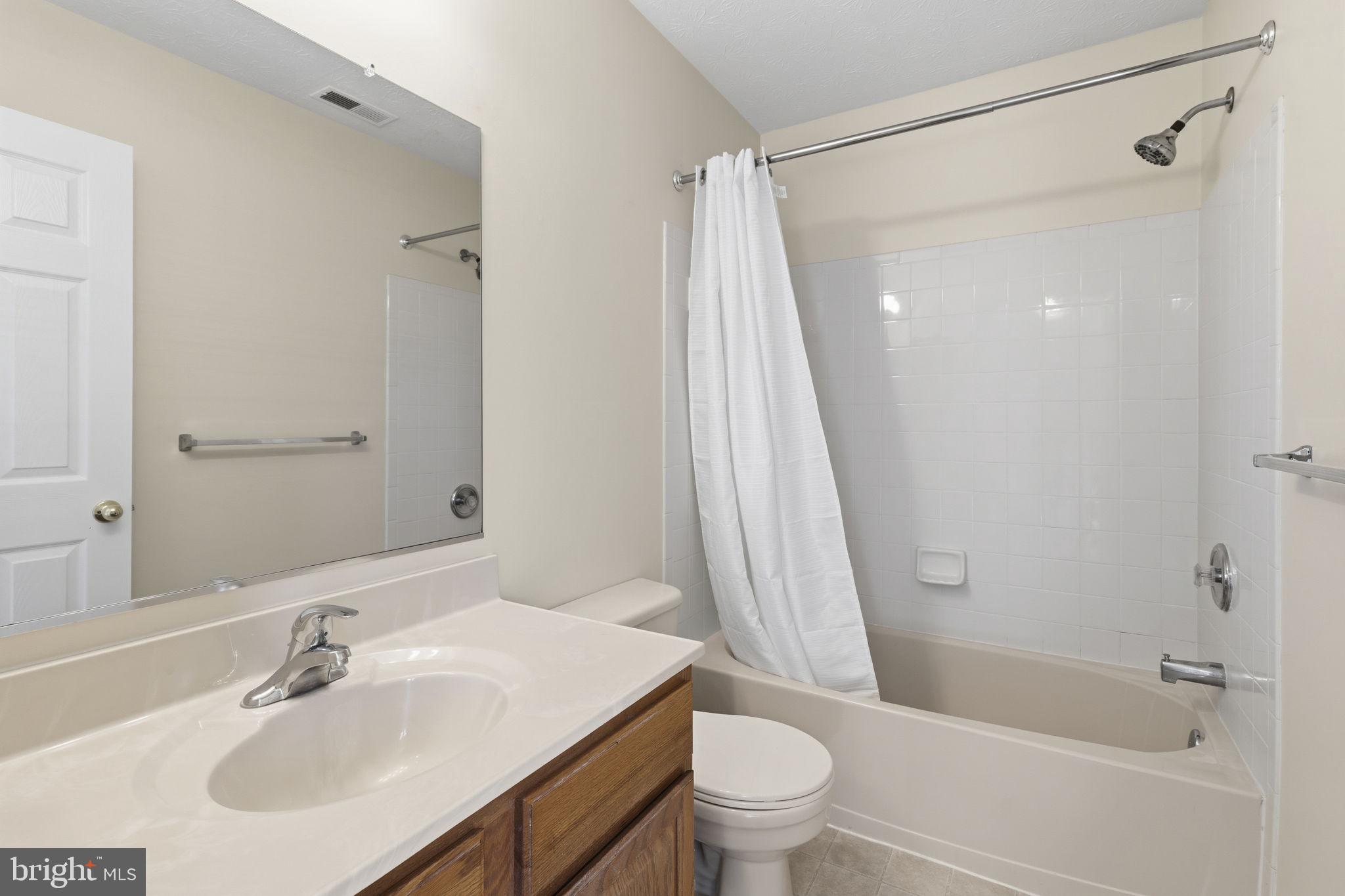 2801 Profitt Path Edgewood, MD 21040 - Photo 11 of 32 a bathroom with a sink toilet and shower