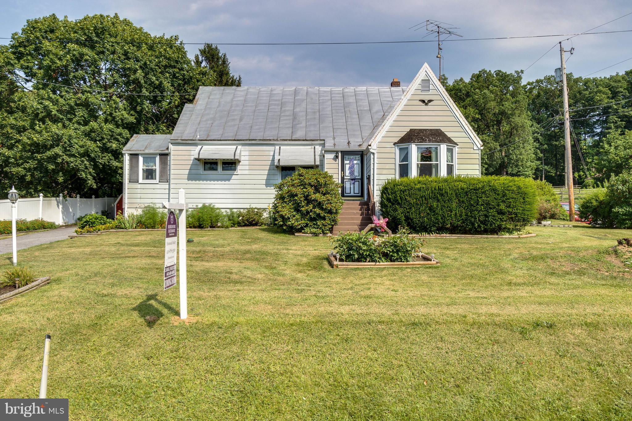 1609 Ridge Road Westminster, MD 21157 - Photo 1 of 28 a front view of a house with a yard