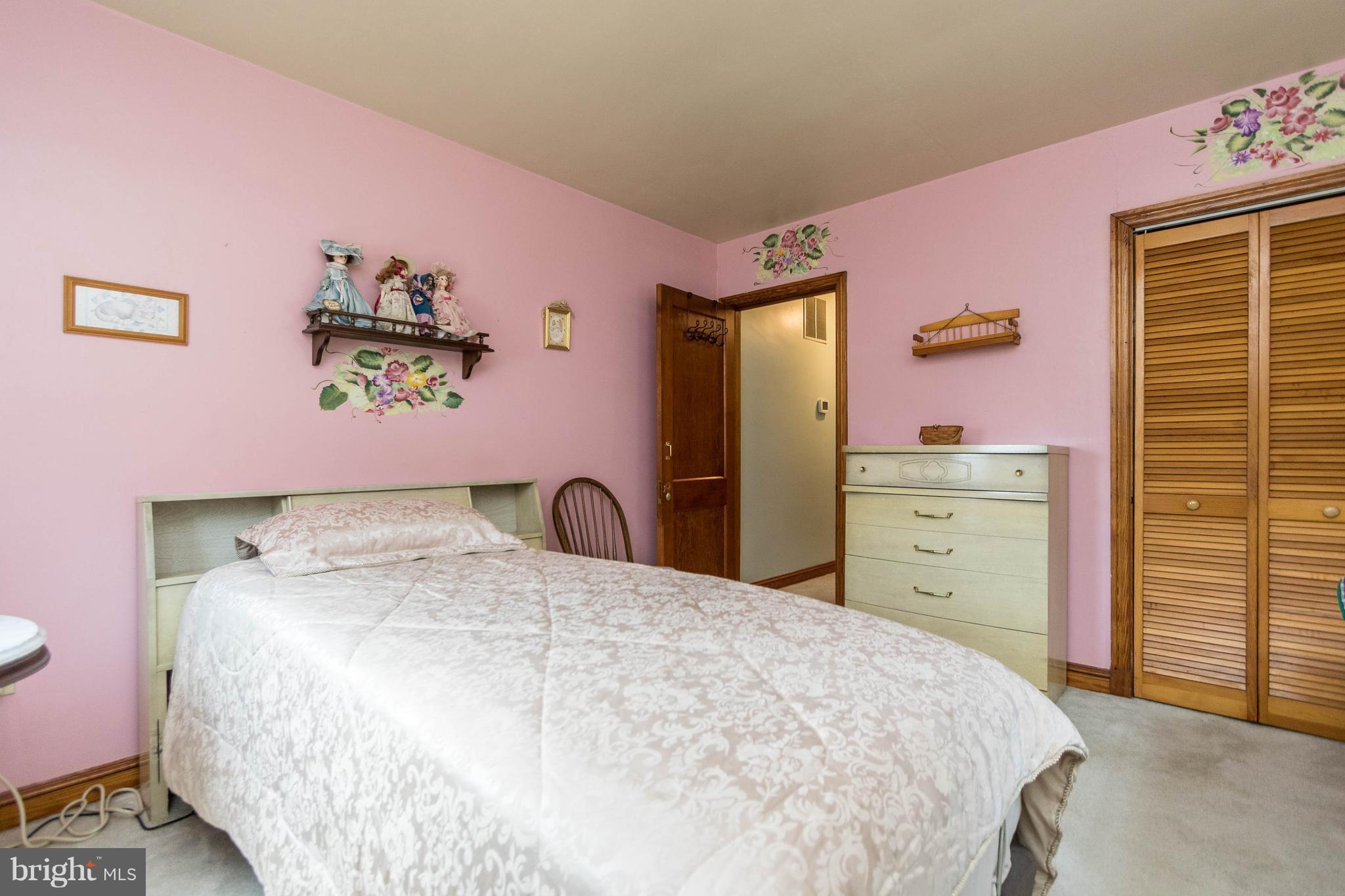 1609 Ridge Road Westminster, MD 21157 - Photo 14 of 28 a bedroom with a bed and a dresser
