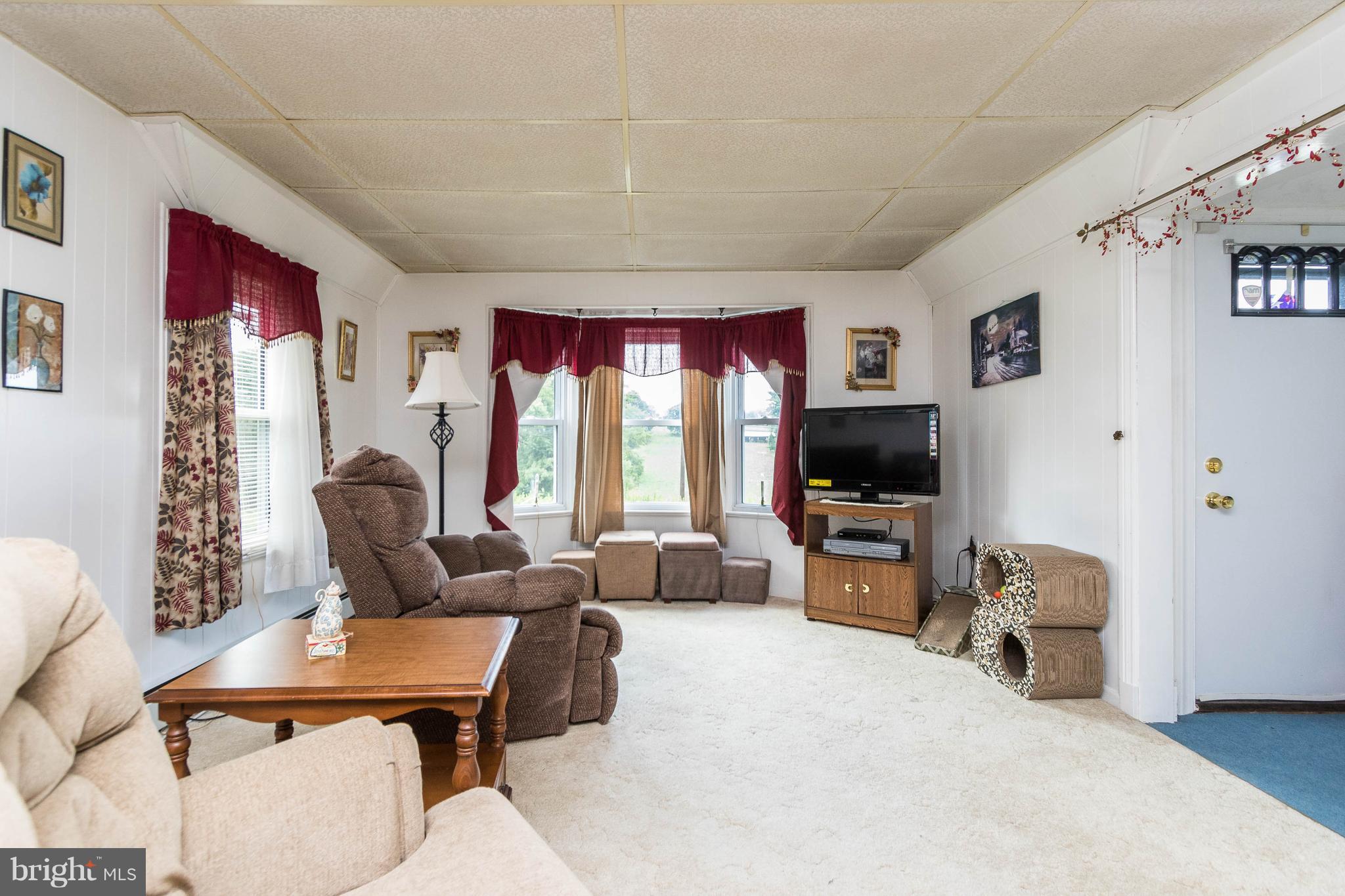 1609 Ridge Road Westminster, MD 21157 - Photo 3 of 28 a living room with furniture and a flat screen tv