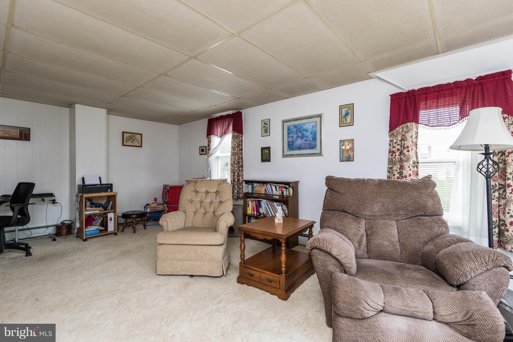 1609 Ridge Road Westminster, MD 21157 - Photo 4 of 28 a living room with furniture and a wooden floor