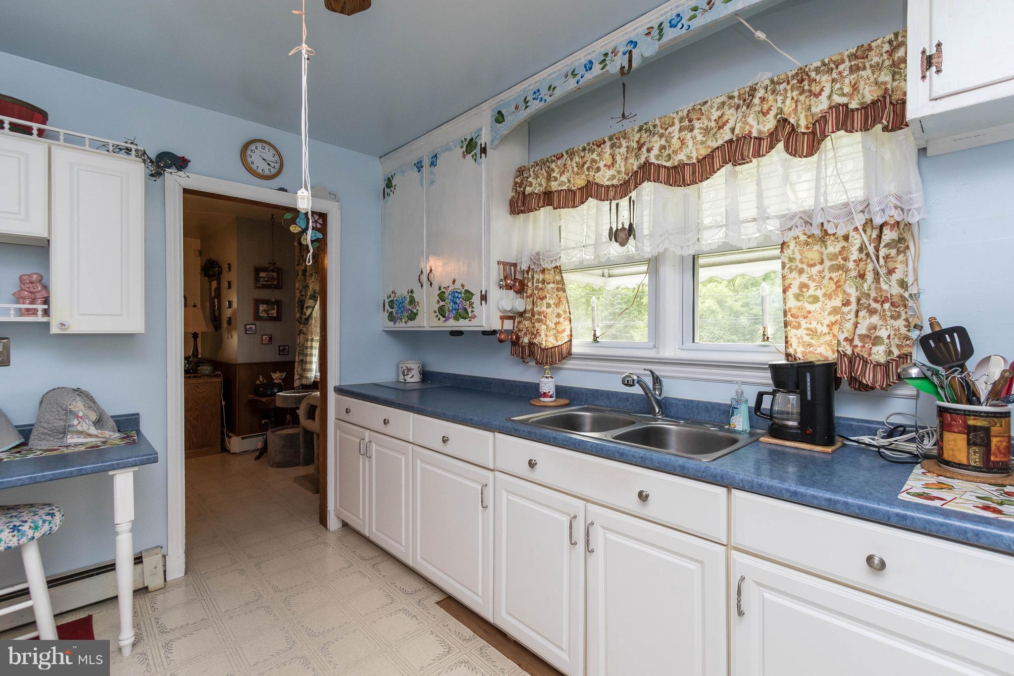 1609 Ridge Road Westminster, MD 21157 - Photo 9 of 28 a kitchen with granite countertop a sink stainless steel appliances and cabinets