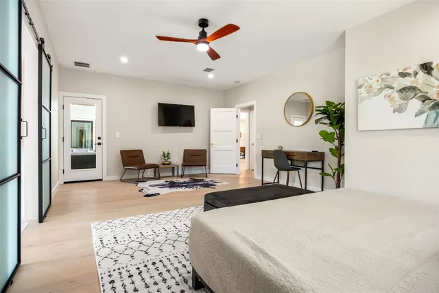a view of a livingroom with furniture and a flat screen tv