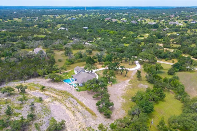an aerial view of a house with garden
