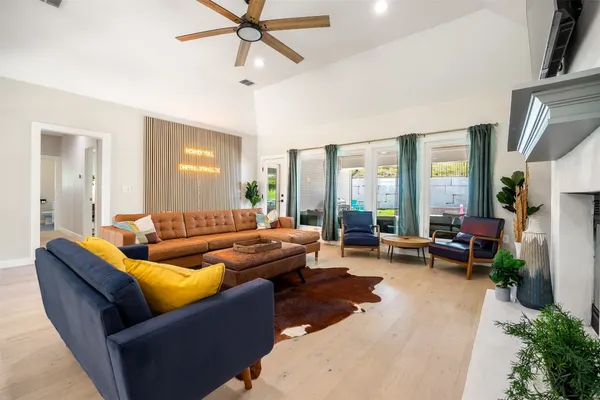 a living room with furniture and a large window