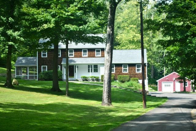91 Dayton Road Redding, CT 06896 - Photo 1 of 1 a front view of a house with a yard