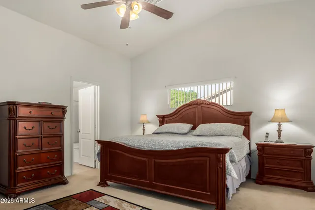 a bedroom with a bed and a dresser