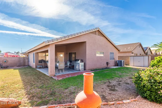 a front view of house with yard and outdoor seating