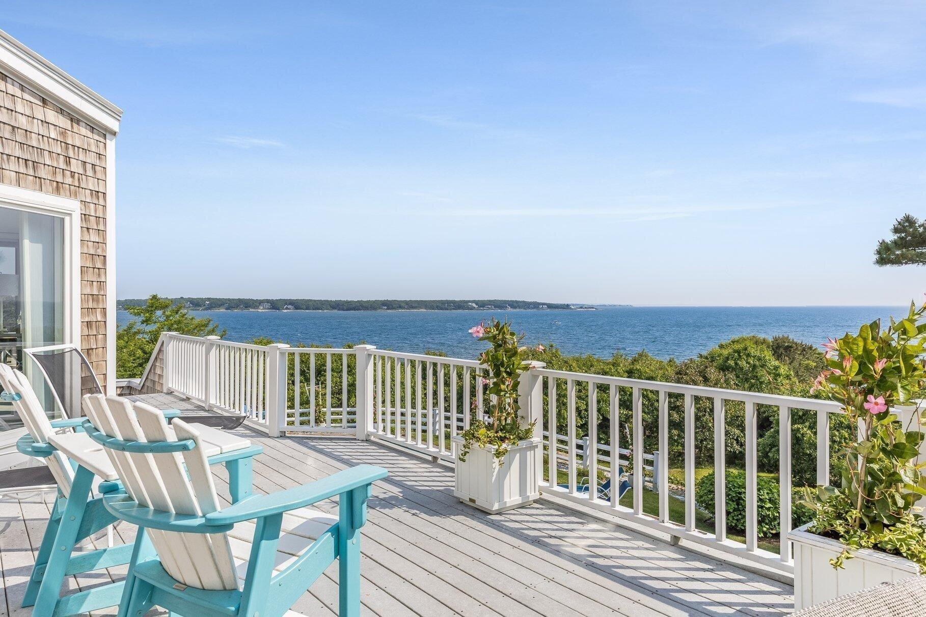 461 Wings Neck Road Pocasset, MA 02559 - Photo 10 of 42 a view of a wooden chairs and bench on the roof