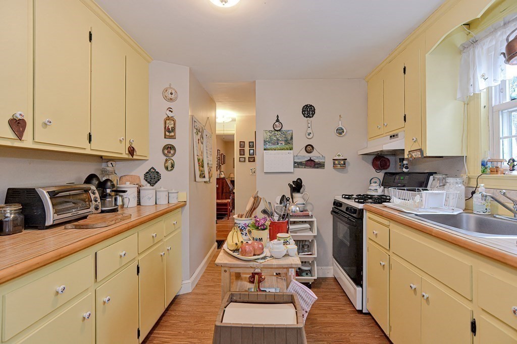 3 Centre Street Natick, MA 01760 - Photo 13 of 23 a kitchen with cabinets a sink and appliances
