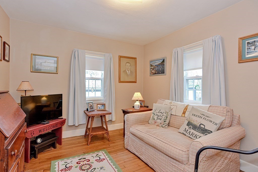 3 Centre Street Natick, MA 01760 - Photo 19 of 23 a living room with furniture and a flat screen tv