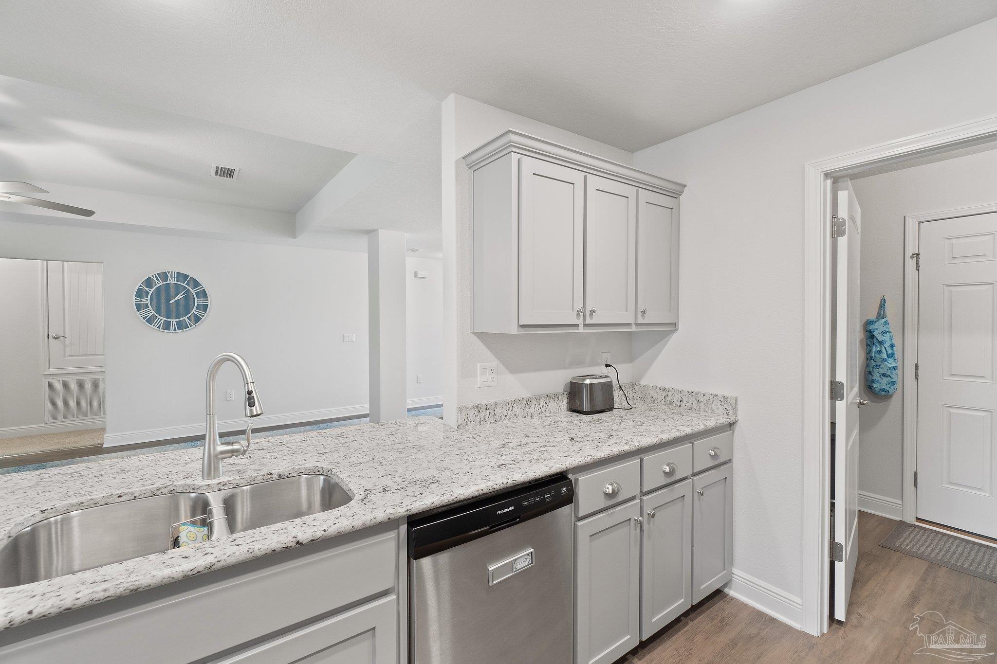 1463 Promenade Loop Cantonment, FL 32533 - Photo 18 of 41 a kitchen with sink and cabinets