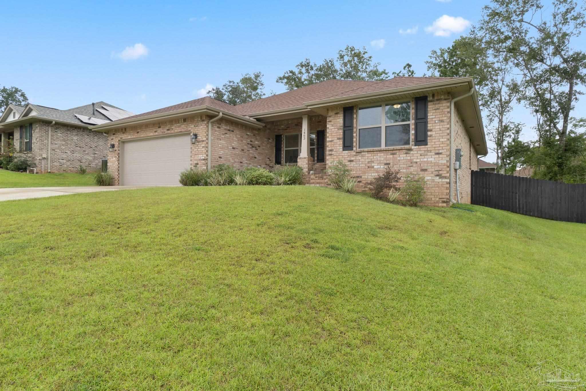 1463 Promenade Loop Cantonment, FL 32533 - Photo 2 of 41 a view of a house with backyard and garden