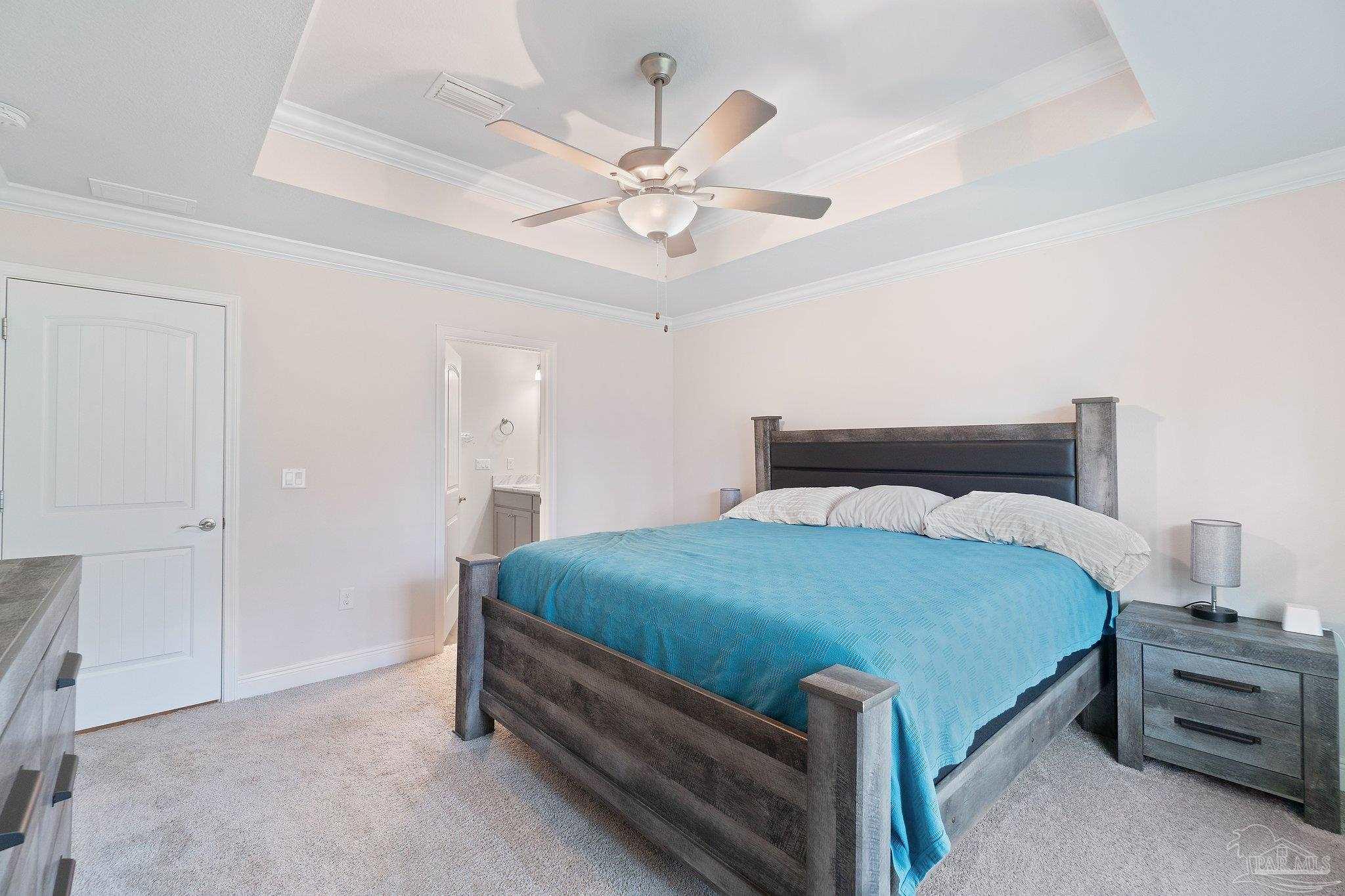 1463 Promenade Loop Cantonment, FL 32533 - Photo 21 of 41 a bedroom with a bed and a chandelier