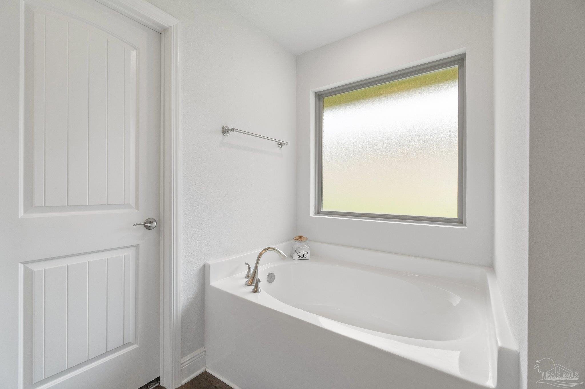 1463 Promenade Loop Cantonment, FL 32533 - Photo 25 of 41 a white bath tub sitting next to a window