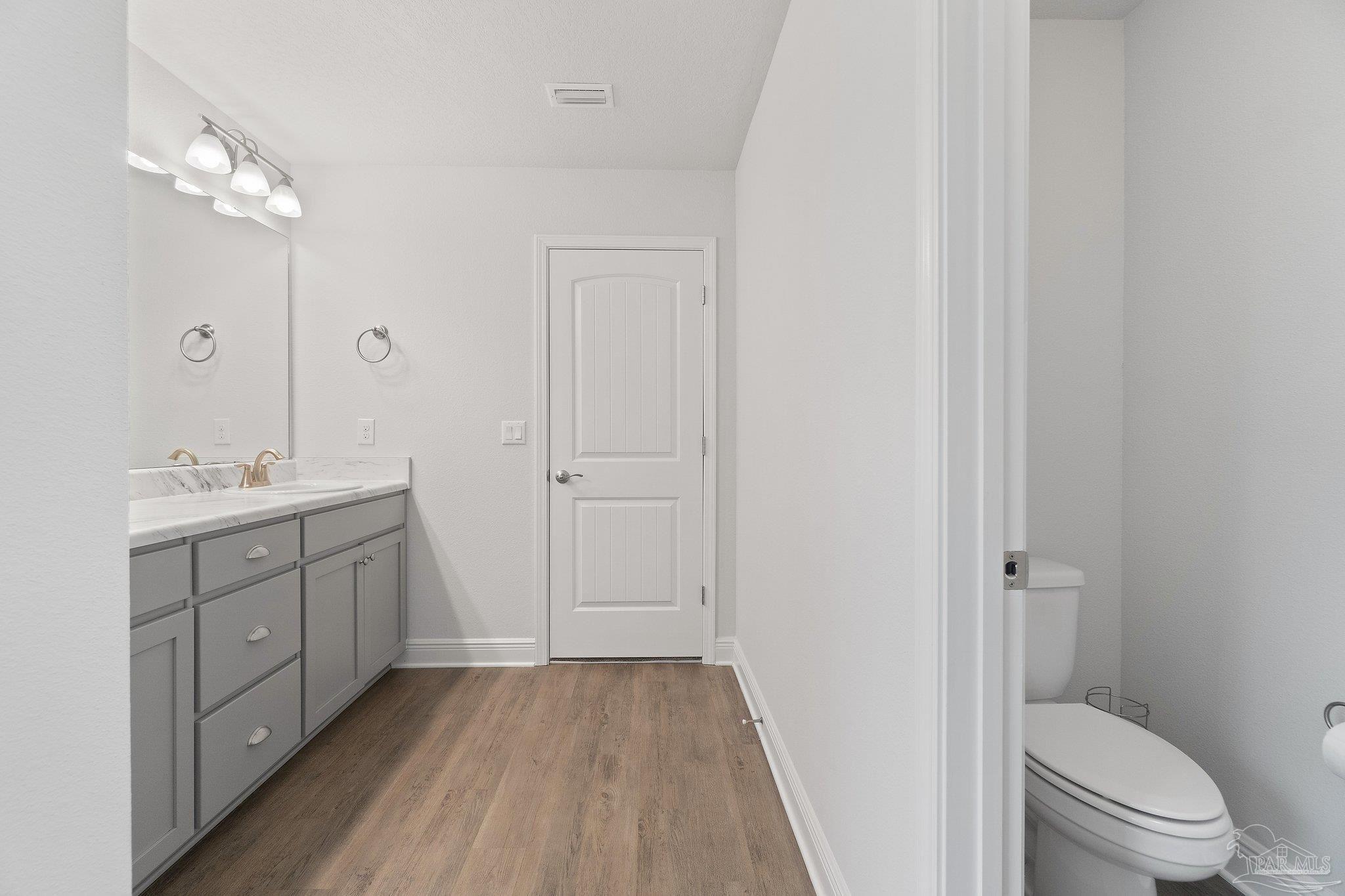 1463 Promenade Loop Cantonment, FL 32533 - Photo 27 of 41 a bathroom with a double vanity sink toilet and shower