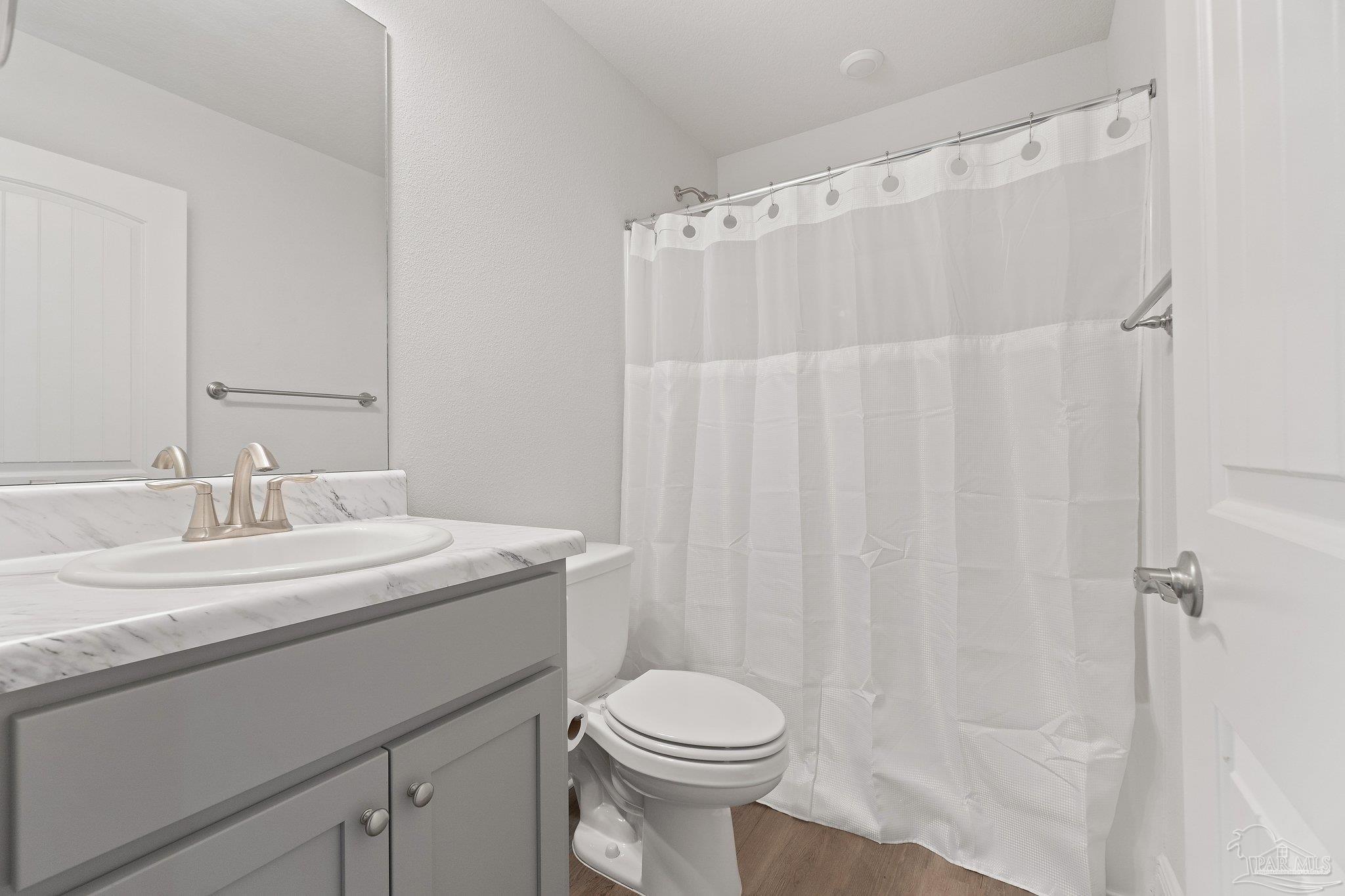 1463 Promenade Loop Cantonment, FL 32533 - Photo 35 of 41 a bathroom with a sink a toilet and shower