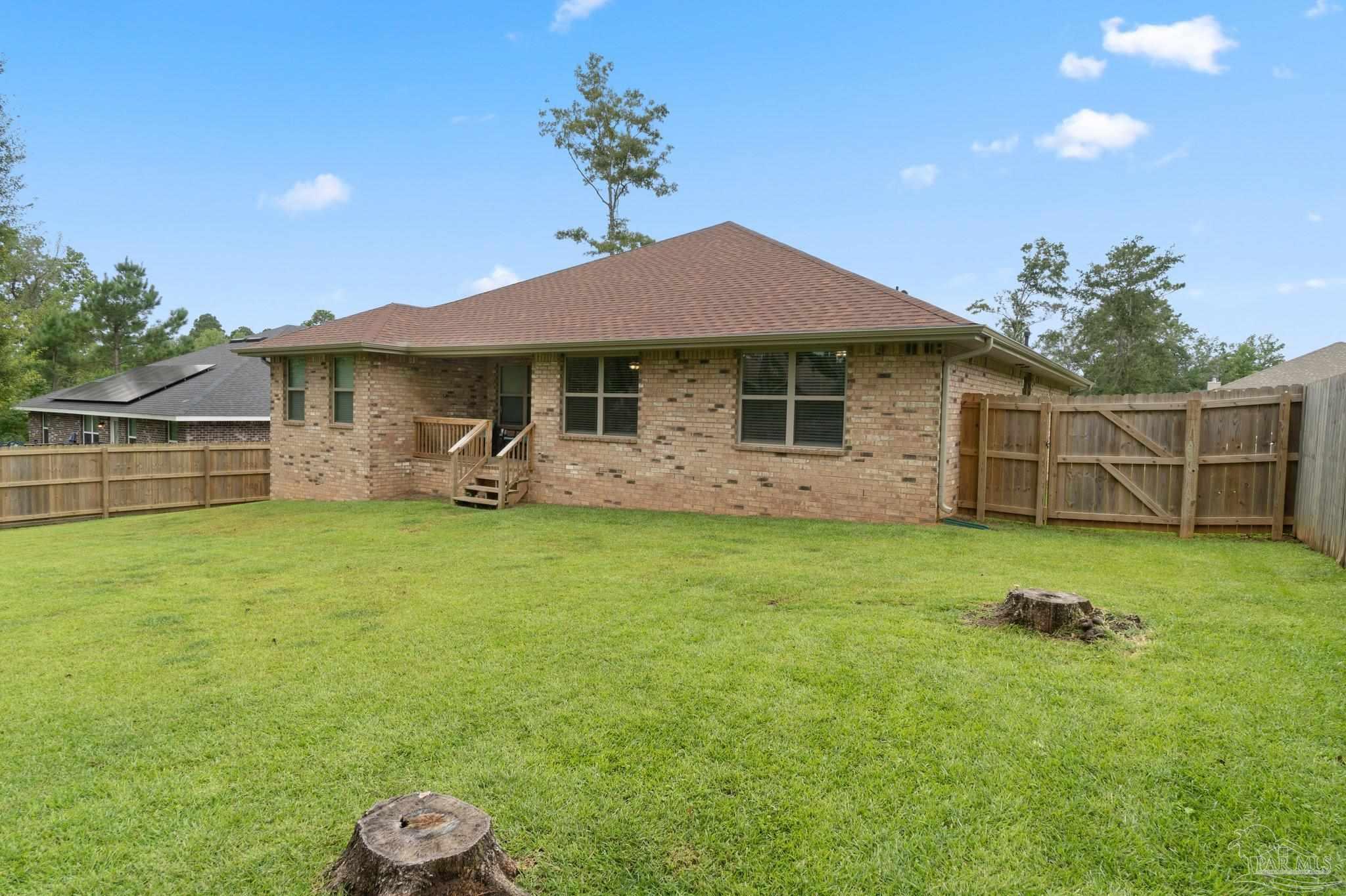 1463 Promenade Loop Cantonment, FL 32533 - Photo 37 of 41 a front view of a house with garden