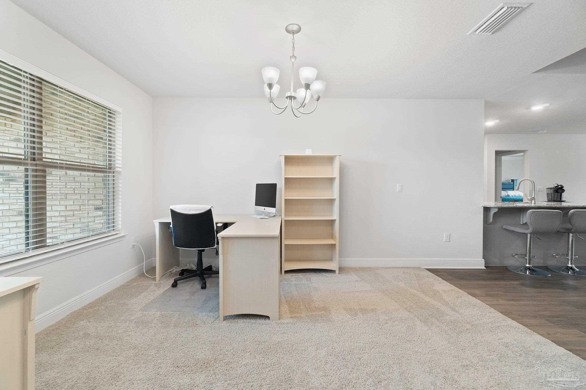 1463 Promenade Loop Cantonment, FL 32533 - Photo 7 of 41 a view of a workspace with furniture and a window