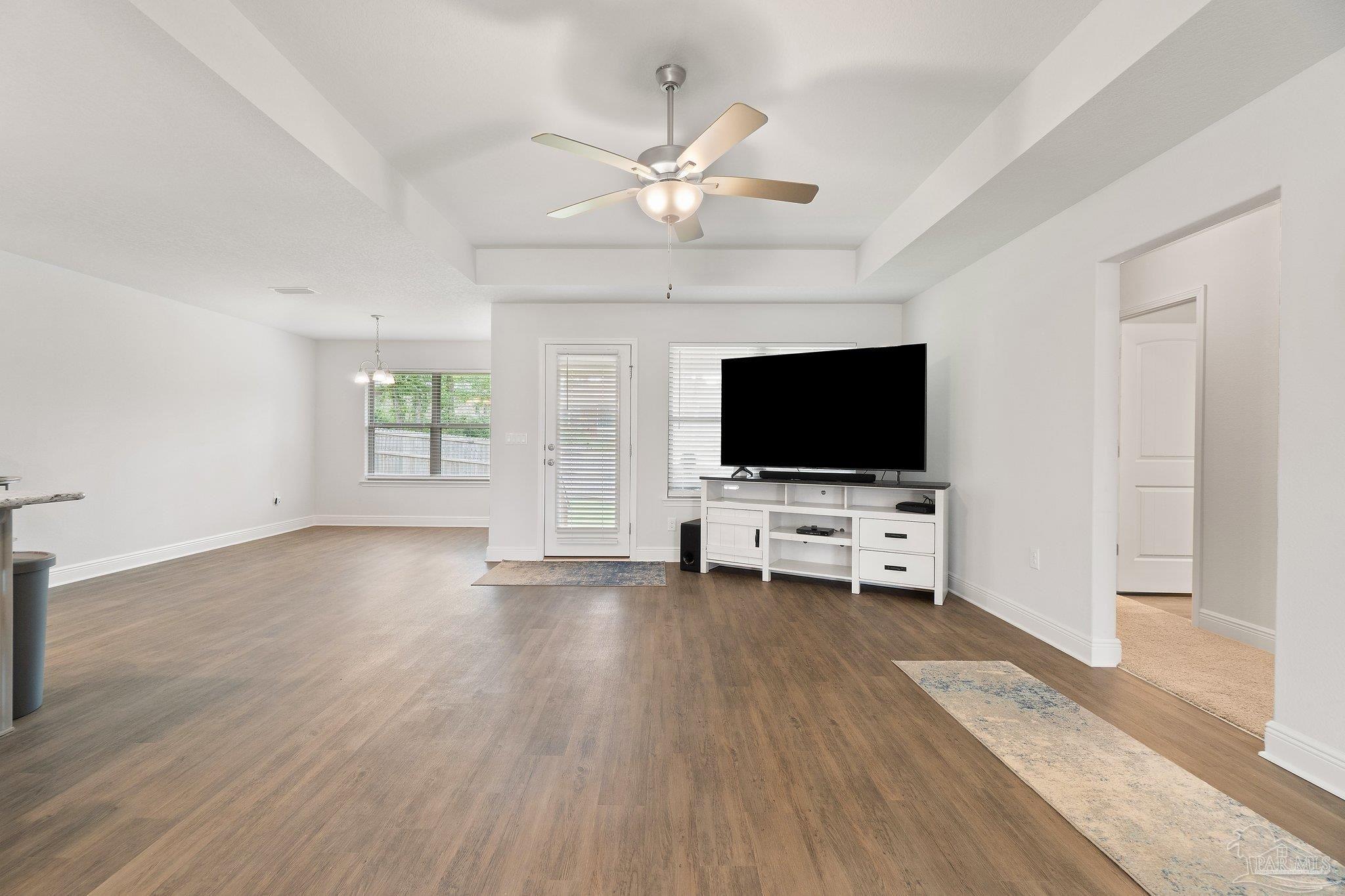 1463 Promenade Loop Cantonment, FL 32533 - Photo 9 of 41 an empty room with wooden floor and windows