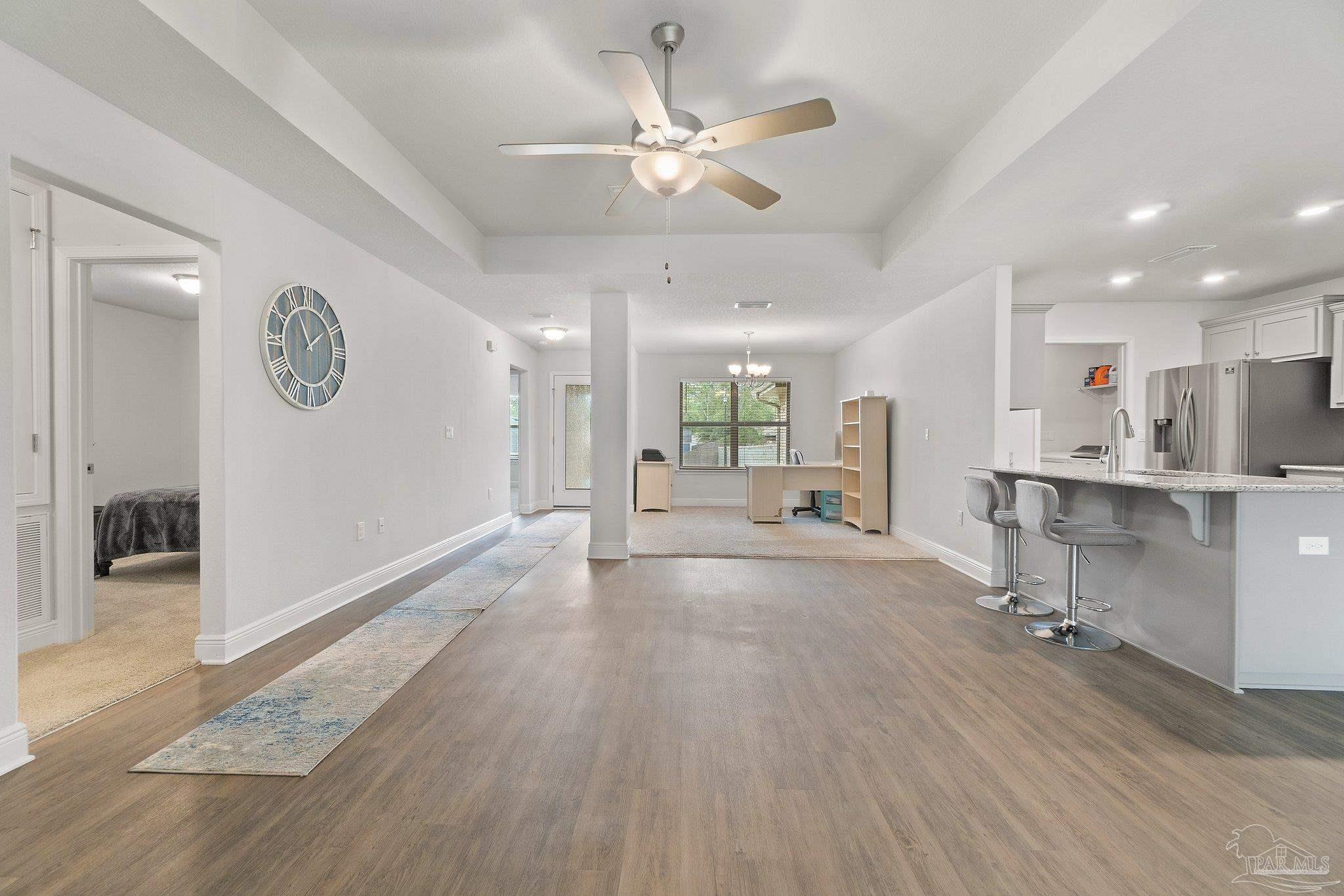 1463 Promenade Loop Cantonment, FL 32533 - Photo 10 of 41 a view of an empty room and kitchen view