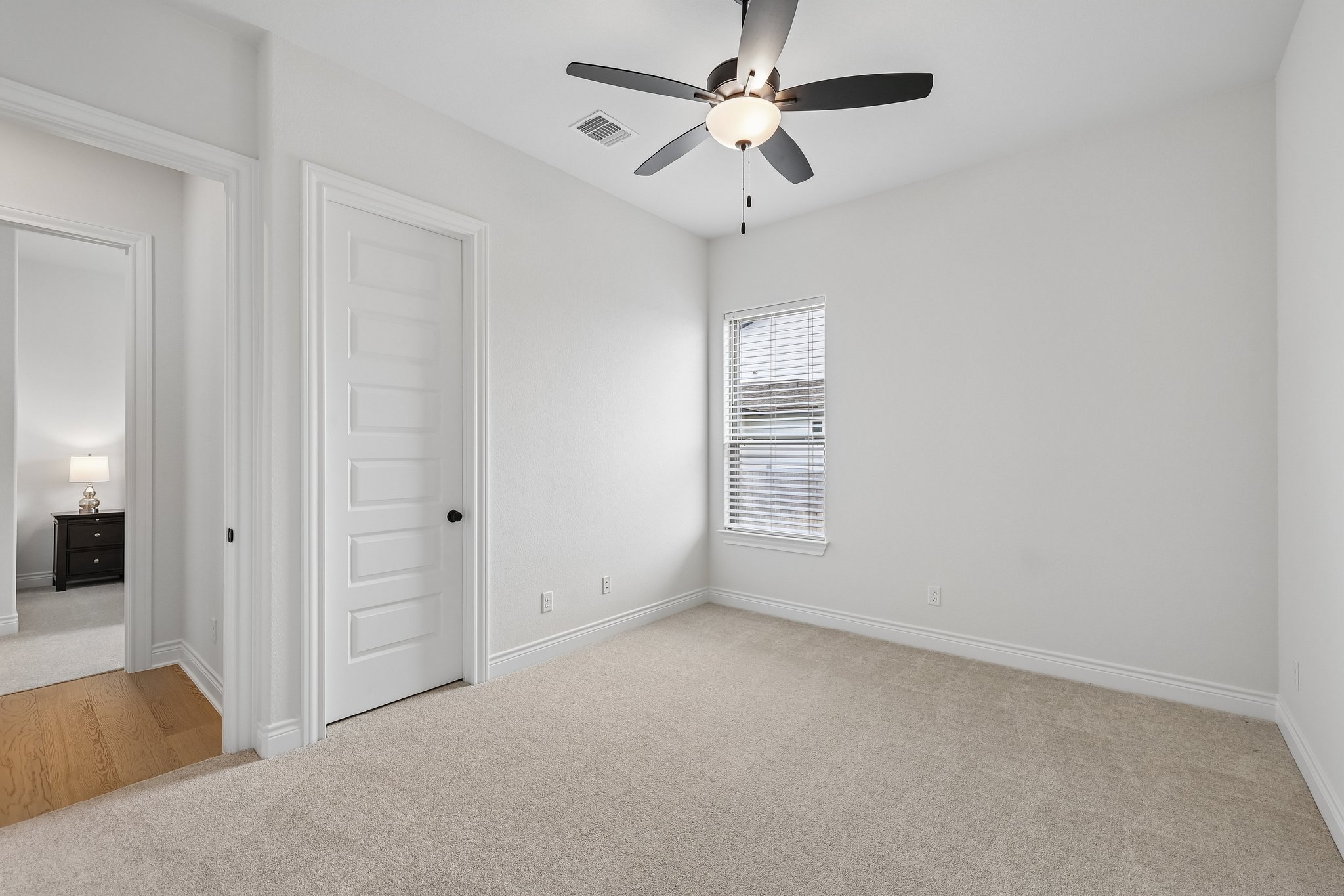 130 Firethorn Loop Bastrop, TX 78602 - Photo 14 of 38 Carpeted room with a ceiling fan light fixture, white walls, and a window with blinds