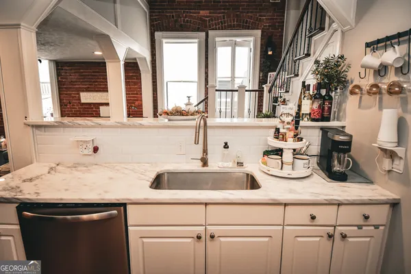 a view of a sink and a window