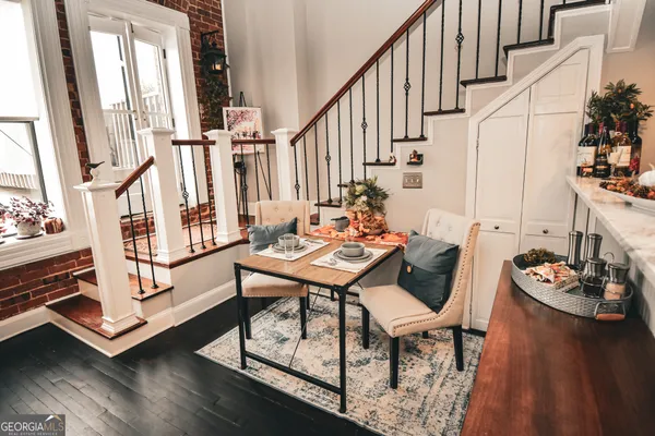 a view of a dining room with furniture window and wooden floor