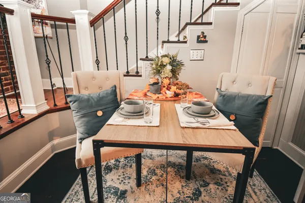a view of a dining room with furniture window and wooden floor