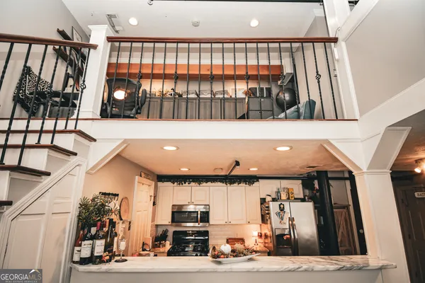 a view of a living room and entryway