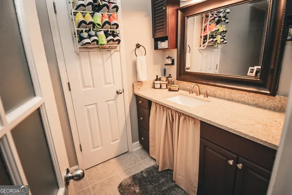 a bathroom with a sink a mirror and a window