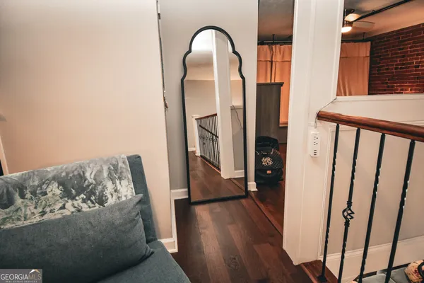 a workspace with furniture and wooden floor