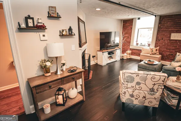 a living room with furniture and a flat screen tv