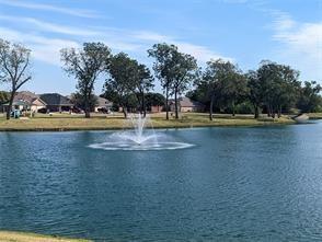 a view of water with trees in the background