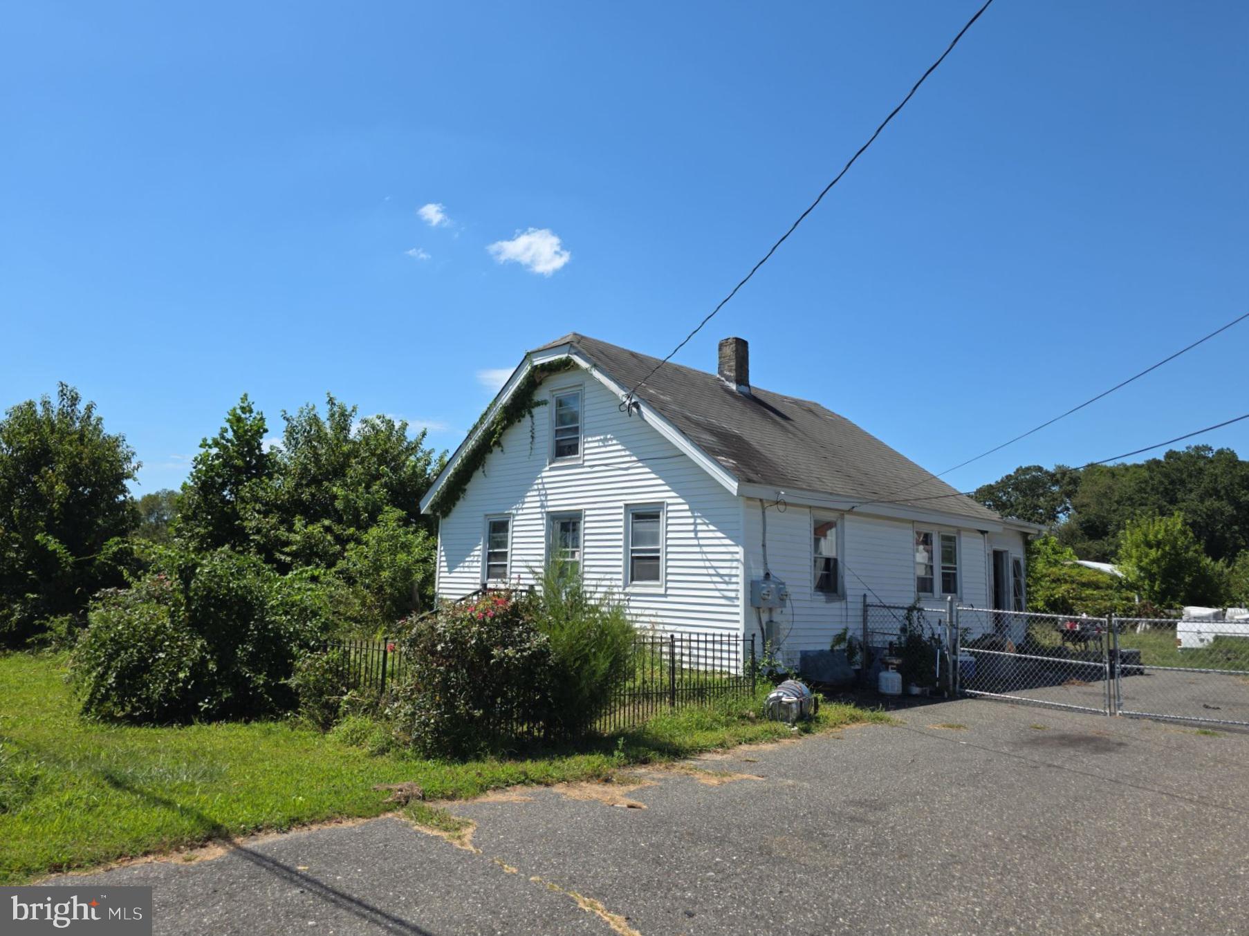 254 Fairton Gouldtown Road Bridgeton, NJ 08302 - Photo 1 of 17 a front view of a house with a garden