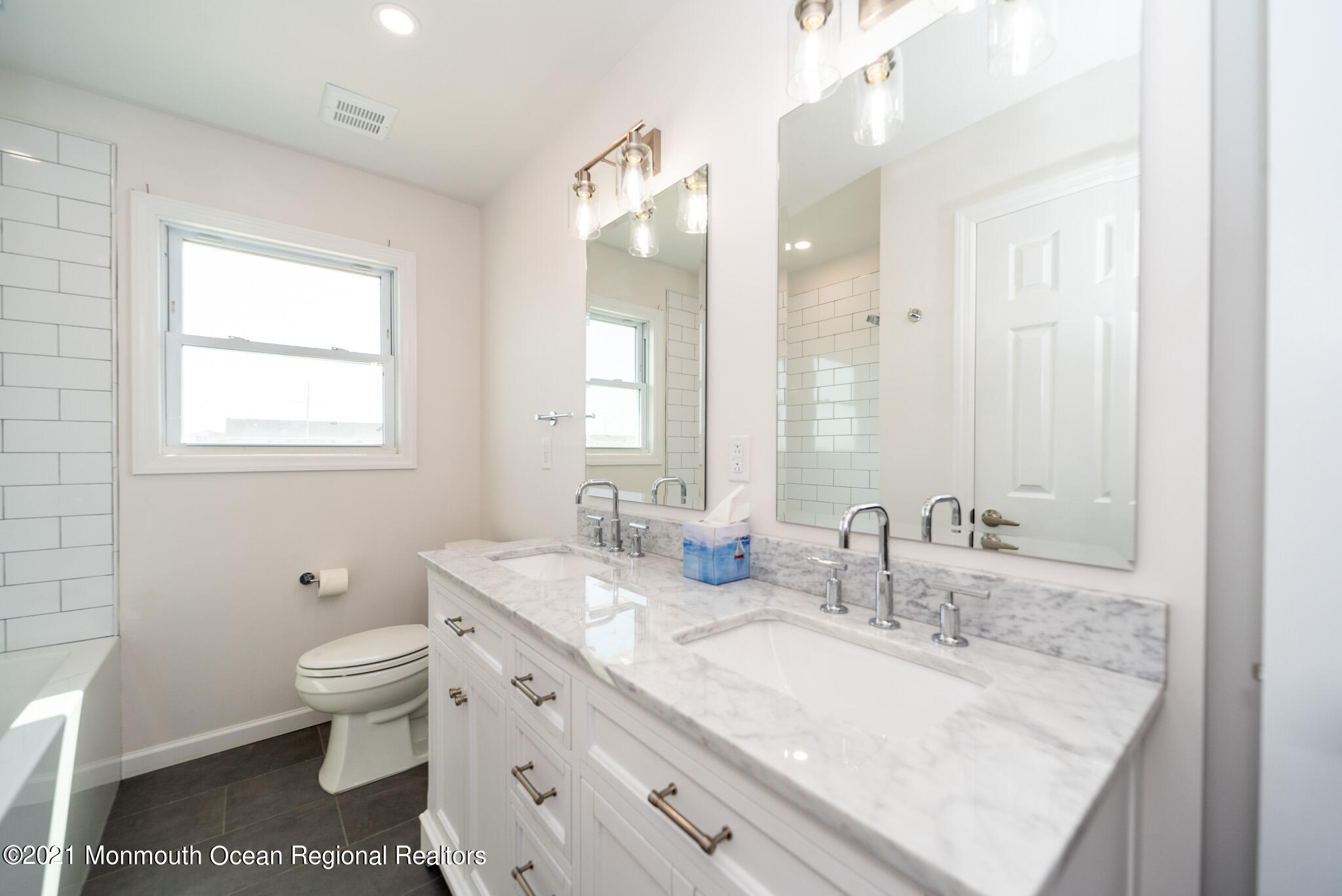222 Edison Road Barnegat, NJ 08005 - Photo 14 of 50 a bathroom with double vanity sink a mirror and a toilet