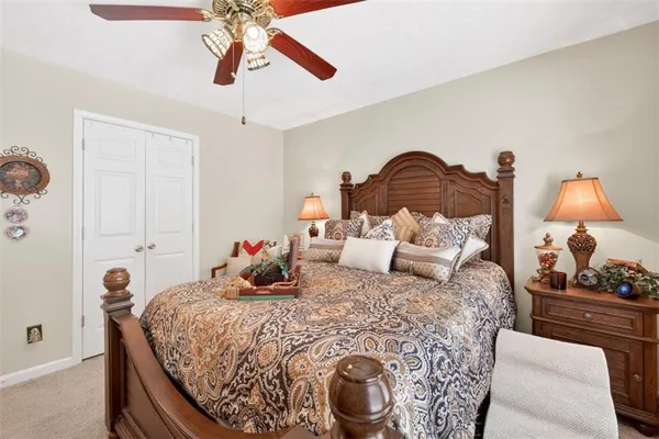 a bed room with a bed and a chandelier