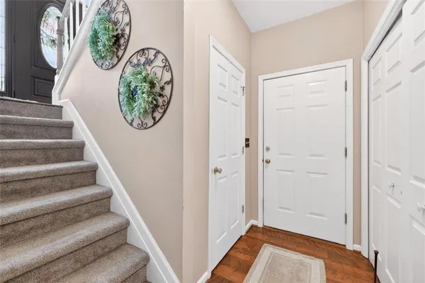 a view of entryway with wooden floor