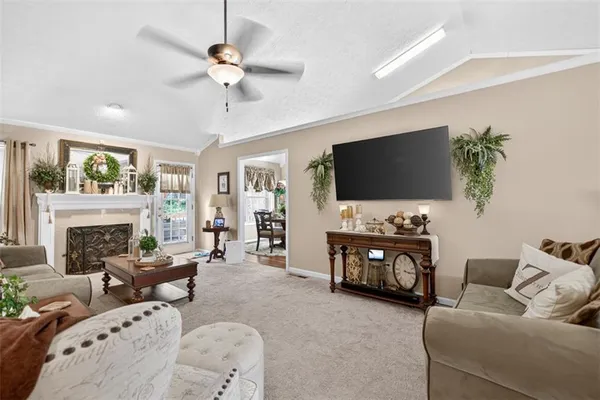 a living room with furniture and a flat screen tv
