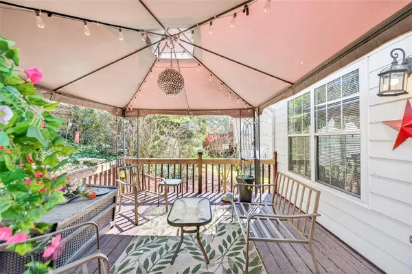 a view of a patio with a table chairs and a table