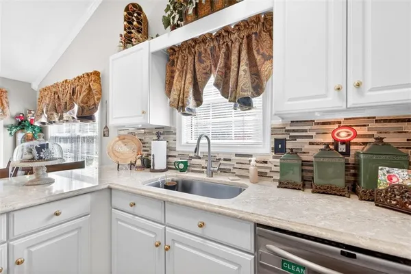 a kitchen with a sink and cabinets
