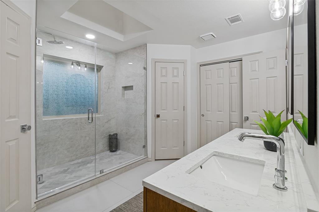 2607 Timberleaf Circle Carrollton, TX 75006 - Photo 10 of 34 Beautiful Primary bathroom with custom showing, his/hers closets