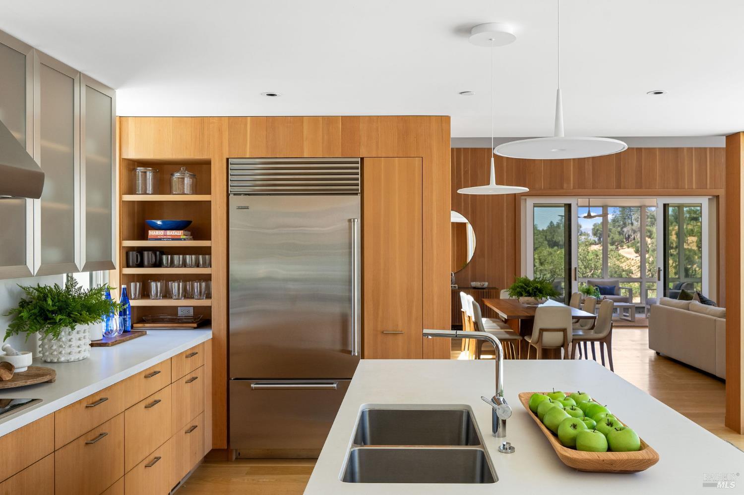 18907 Highway 128 Calistoga, CA 94515 - Photo 17 of 46 a kitchen with sink refrigerator and dining table