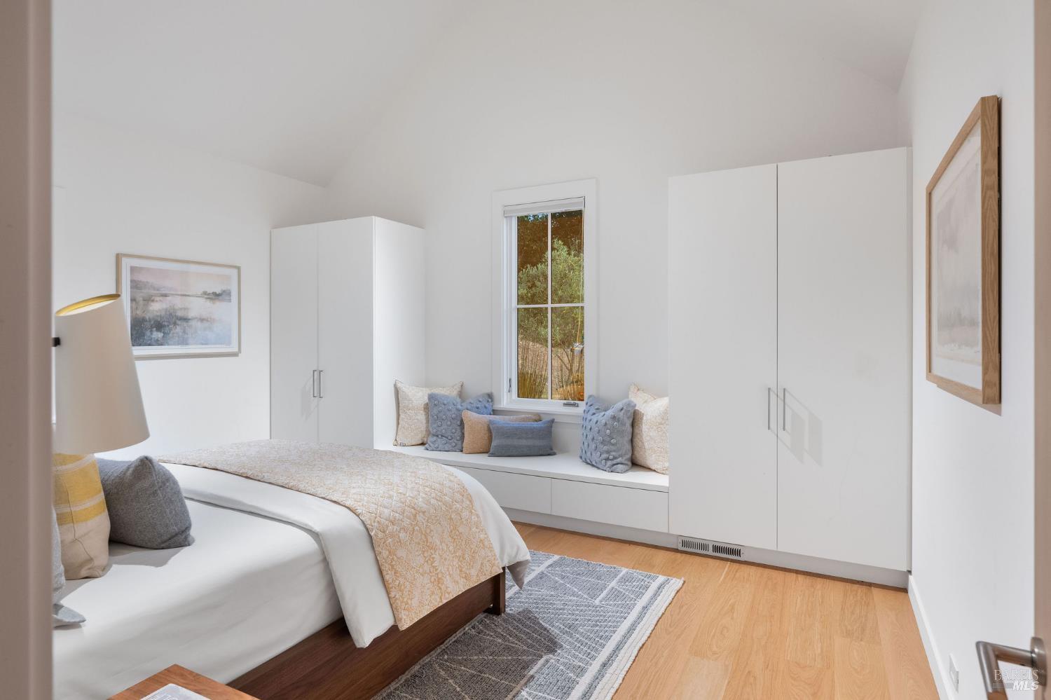 18907 Highway 128 Calistoga, CA 94515 - Photo 19 of 46 a bedroom with a bed and wooden floor