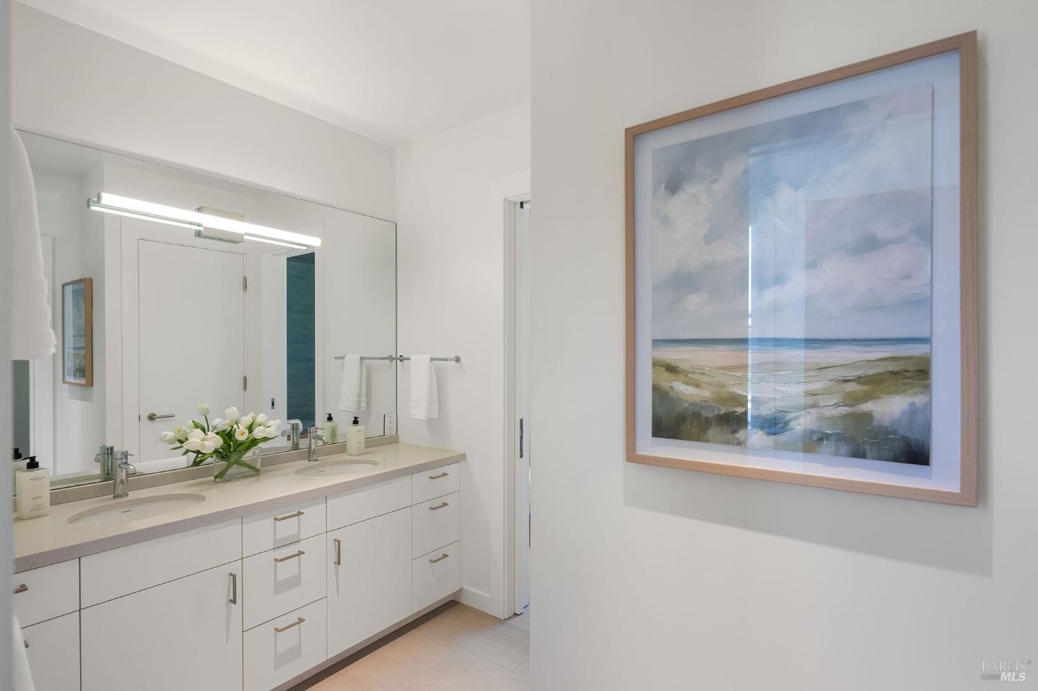 18907 Highway 128 Calistoga, CA 94515 - Photo 26 of 46 a bathroom with a double vanity sink and a mirror