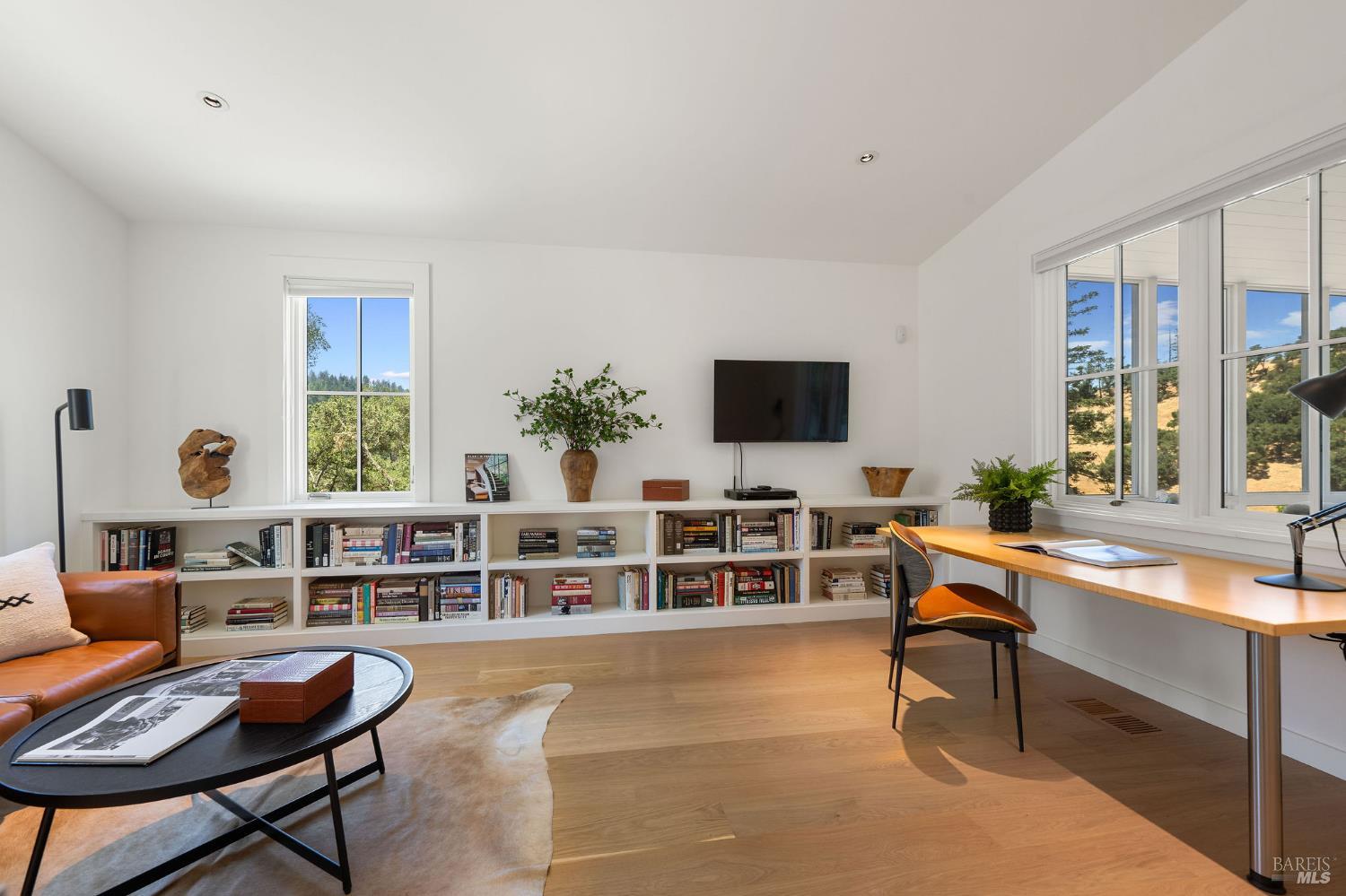 18907 Highway 128 Calistoga, CA 94515 - Photo 29 of 46 a living room with furniture a flat screen tv and a window