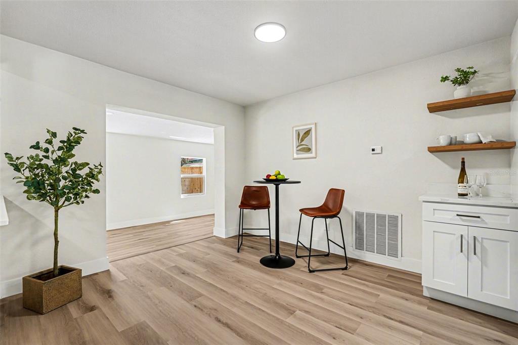 707 Queens Court Seffner, FL 33584 - Photo 11 of 28 a view of a workspace with furniture and wooden floor