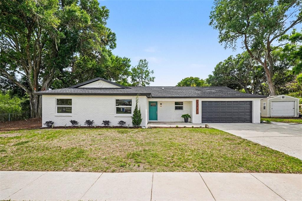 707 Queens Court Seffner, FL 33584 - Photo 2 of 28 a view of a house with a yard